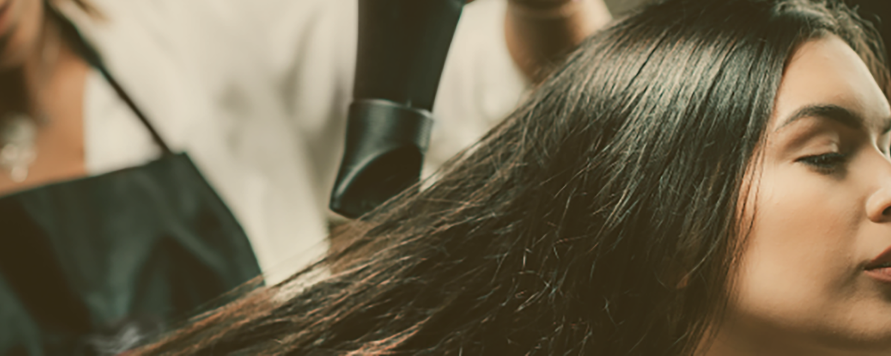 Makeup artist applying makeup to client